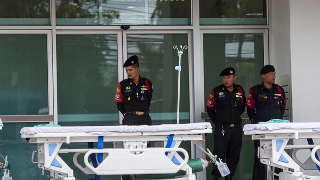 Thai Police stand in front of the hospital in Chiang Rai as rescue operations continue. Picture:  AFP.