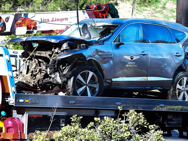 A tow truck recovers the vehicle driven by Tiger Woods.