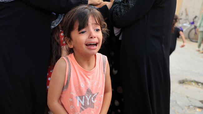 A grieving child during the funeral of members of the Abu Quta family, who were killed in Israeli strikes on the Palestinian city of Rafah. Picture: Said Khatib/AFP