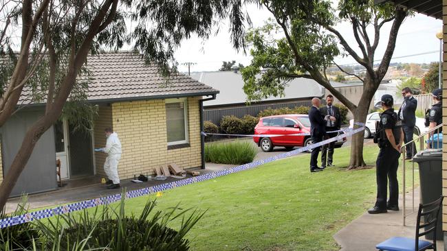 Police, detectives and forensic officers at block of units. Picture Dean Martin