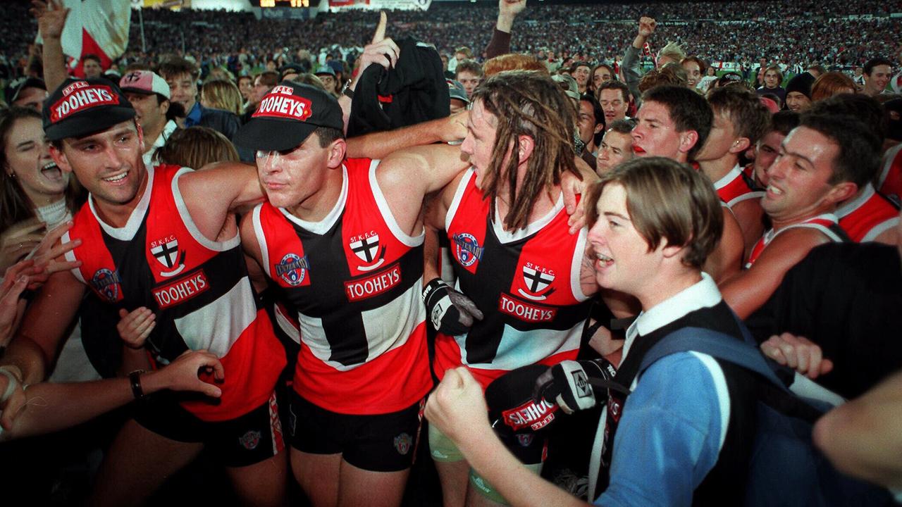 Peter Everitt and his teammates celebrate winning the 1996 Ansett Cup against Carlton.
