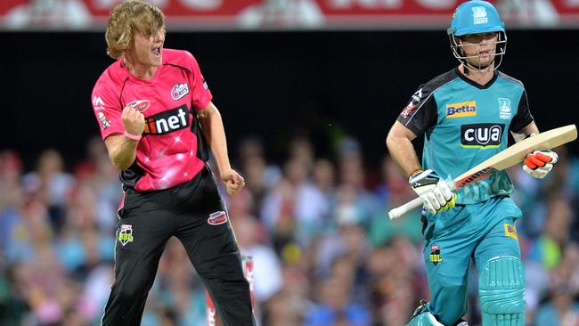 Henry Thornton of the Sixers celebrates the wicket of Jimmy Peirson of the Heat.