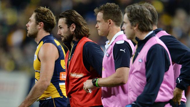 West Coast’s Chris Masten in the red vest after being subbed out.