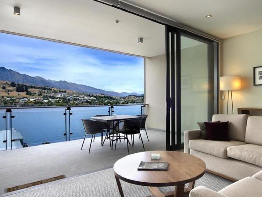 Rooms have sweeping views of the lake and mountains.