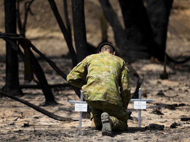 Lieutenant Kynan Lang from the 10th/27th Battalion visits the scene where his uncle and cousin died in a bushfire to place a memorial on Kangaroo Island.