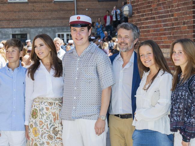 The future king dons a traditional cap for the ceremony as he poses with his parents and siblings Prince Vincent, Princess Isabella and Princess Josephine. Picture: Getty Images