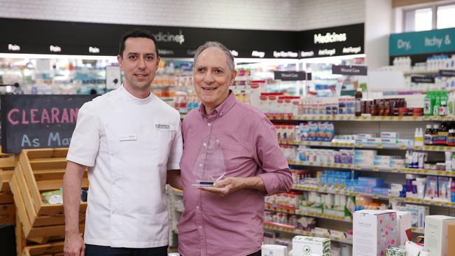 Calanna Pharmacy Group general manager Matthew Calanna with his father Mario Calanna in their Woree pharmacy. Picture: Brendan Radke