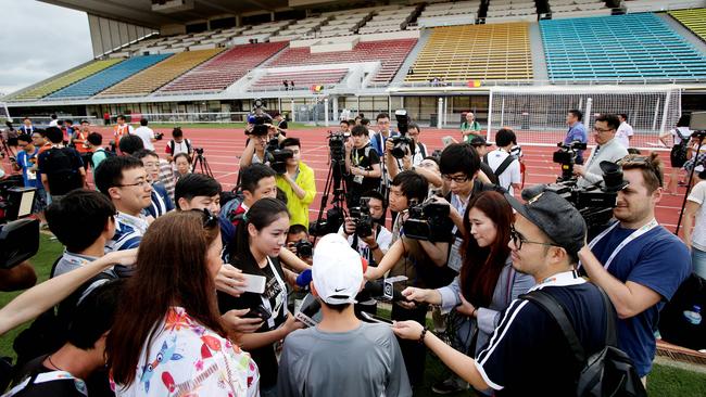 White, a Chinese celebrity, says he’s torn over Socceroos v China.