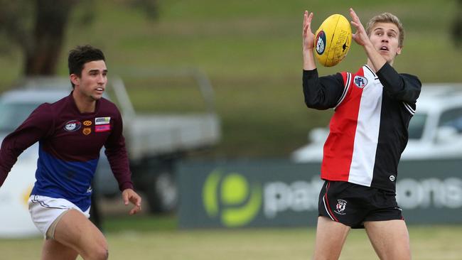 Watsonia’s Daniel Gervasoni marks against Banyule. Picture: Hamish Blair.