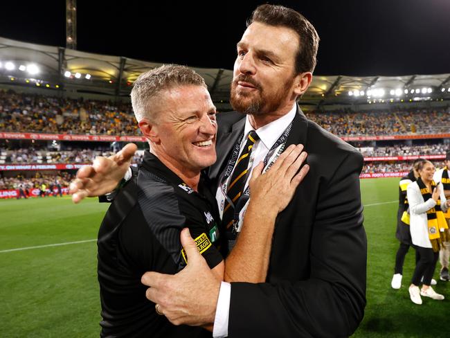 BRISBANE, AUSTRALIA - OCTOBER 24: Damien Hardwick, Senior Coach of the Tigers and CEO Brendon Gale celebrate during the 2020 Toyota AFL Grand Final match between the Richmond Tigers and the Geelong Cats at The Gabba on October 24, 2020 in Brisbane, Australia. (Photo by Michael Willson/AFL Photos via Getty Images)