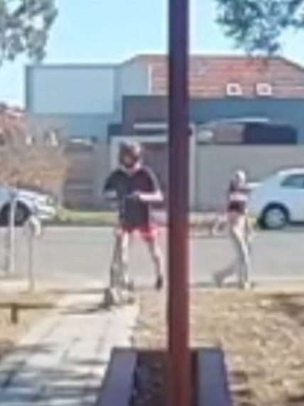 A man on a scooter, watched by an accomplice, is alleged to have taken the package from Mr Ijomah’s home. Picture: Supplied
