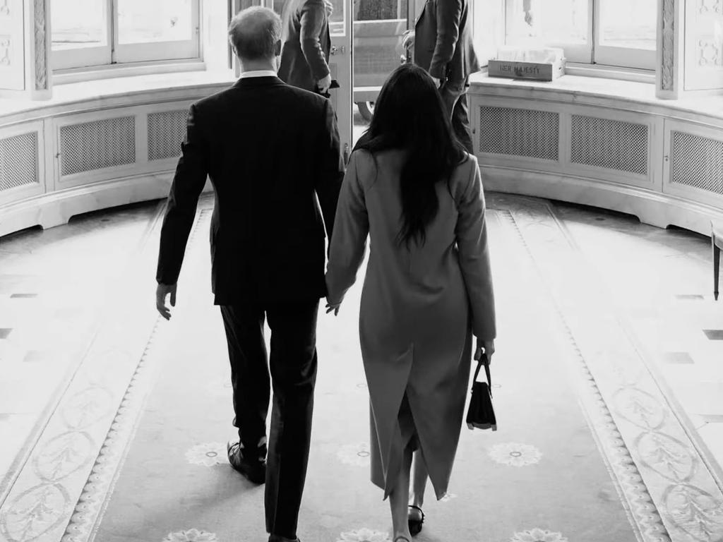 Prince Harry and Meghan Markle in a seemingly professional photo taken in Buckingham Palace shown in their docuseries. Picture: Netflix