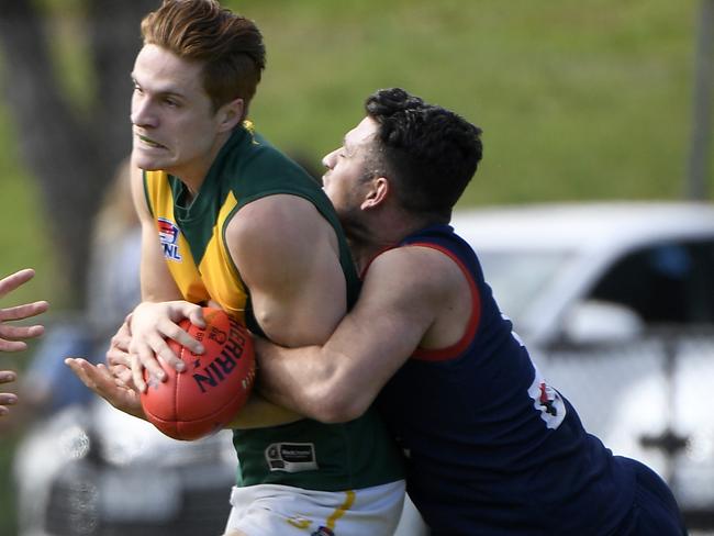 Districts ball-winner Mladen Josic applies a tackle in the 2018 Division 3 grand final.