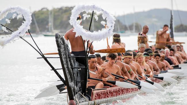 Traditional waka paddle down the Waitangi River on Waitangi Day. Picture: AAP.