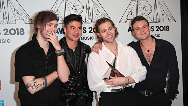 5 Seconds of Summer (5SOS) pose for a photograph after winning the Best Group, Best Pop Release and Apple Music Song of the Year during the 32nd ARIA Awards at The Star in Sydney, Wednesday, November 28, 2018. Picture: AAP/Adam Yip