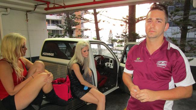 Sin City VIP host Daniel Wilson with Chrystal (left) and Sarah in a carpark on Orchid Avenue at about 5am after they all finished work