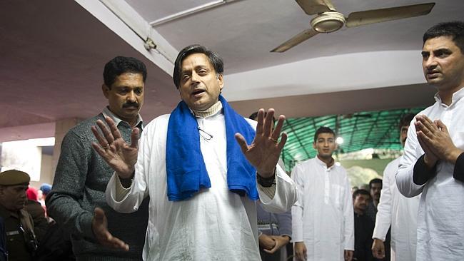 India's Human Resources Minister Shashi Tharoor attending the ceremonial cremation of his wife following her "un...