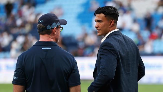 SYDNEY, AUSTRALIA - FEBRUARY 28: Waratahs head coach Dan McKellar talks to injured Waratah player Joseph Suaalii during warm up ahead of the round three Super Rugby Pacific match between NSW Waratahs and Fijian Drua at Allianz Stadium, on February 28, 2025, in Sydney, Australia. (Photo by Cameron Spencer/Getty Images)