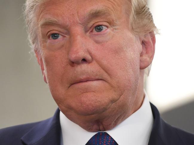 US President Donald Trump visits his campaign headquarters in Arlington, Virginia, November 3, 2020. - A bitterly divided America was going to the polls on Tuesday amid the worst pandemic in a century and an economic crisis to decide whether to give President Donald Trump four more years or send Democrat Joe Biden to the White House. A record-breaking number of early votes -- more than 100 million -- have already been cast in an election that has the nation on edge and is being closely watched in capitals around the world. (Photo by SAUL LOEB / AFP)