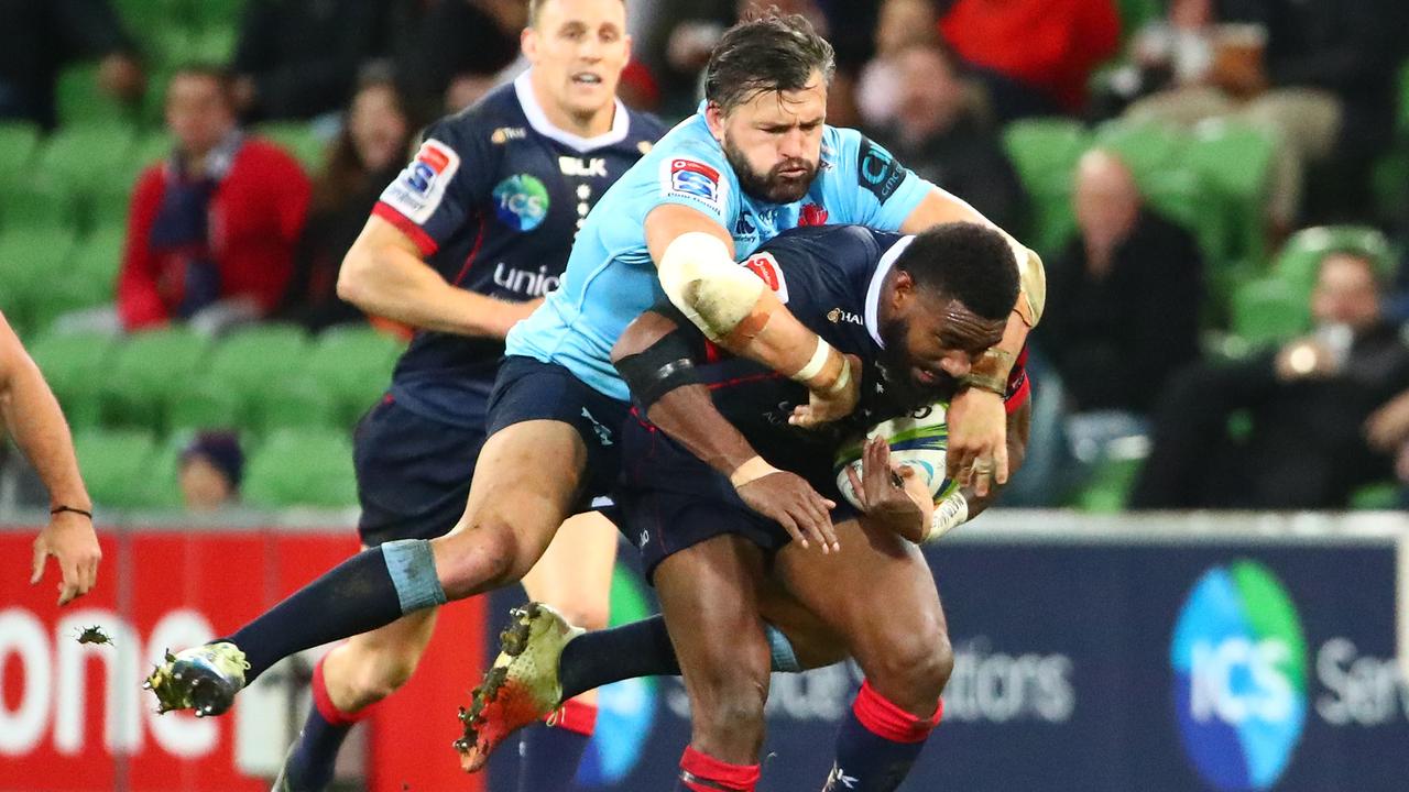 Marika Koroibete of the Rebels is tackled by Adam Ashley-Cooper of the Waratahs.