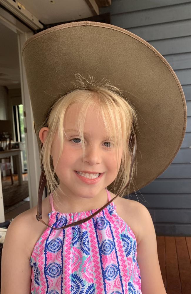 Seven-year-old Riliee proudly wears her late father Daniel Garfort’s hat. Picture: Supplied by family