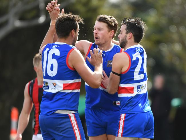 Daniel Cooper (centre) of South Croydon reacts after a goal  during the EFL Div 1 preliminary final at Bayswater Oval, Melbourne, Saturday, September 15, 2018.  Sth Croydon v Blackburn. (AAP Image/James Ross) NO ARCHIVING