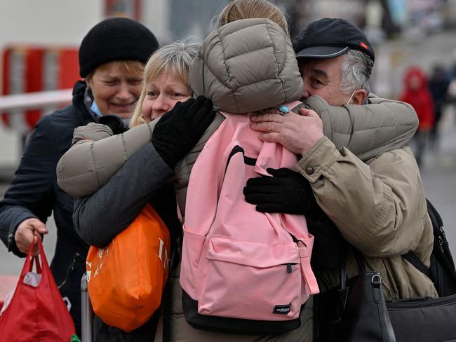 A family reunites just after crossing the Ukrainian borders into Poland, at the Medyka border crossing where thousands of refugees lee the war in Ukraine on March 6, 2022. - The number of people fleeing Russia's invasion of Ukraine has topped 1.5 million, making it Europe's "fastest growing refugee crisis" since World War II, the United Nations said on March 6, 2022. "More than 1.5 million refugees from Ukraine have crossed into neighbouring countries in 10 days â- the fastest growing refugee crisis in Europe since World War II," it said in a statement on Twitter. (Photo by Louisa GOULIAMAKI / AFP)