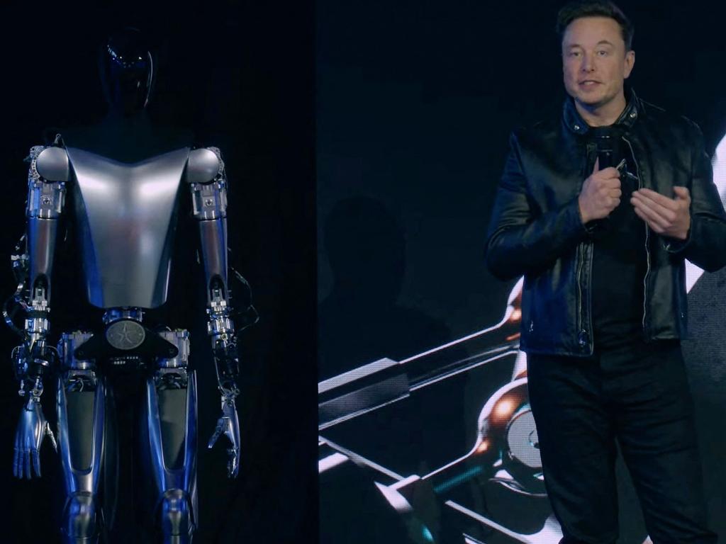 Elon Musk with the Optimus robot. Picture: Tesla/AFP