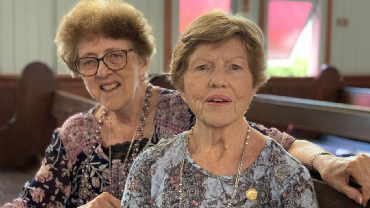 Margaret Harvison OAM (left) sits with legendary St Paul’s organist Mavis Braithwaite on Saturday. Picture: Duncan Evans