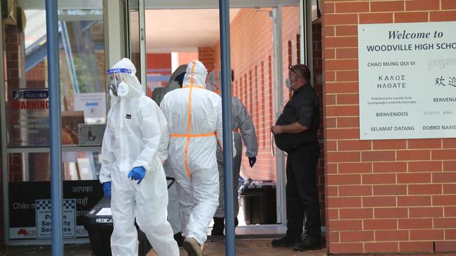 Cleaners at Woodville High, which is undergoing a deep clean after the positive test. Picture: Tait Schmaal