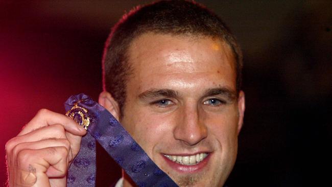 Chris Judd poses with the Brownlow Medal he won in 2004.