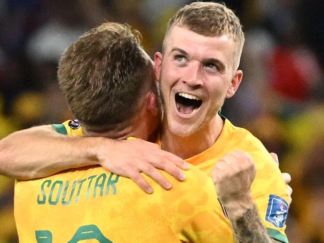 CORRECTION / Australia's defender #19 Harry Souttar (L) and Australia's midfielder #14 Riley McGree celebrate after they won the Qatar 2022 World Cup Group D football match between Australia and Denmark at the Al-Janoub Stadium in Al-Wakrah, south of Doha on November 30, 2022. (Photo by NATALIA KOLESNIKOVA / AFP) / âThe erroneous mention appearing in the metadata of this photo by NATALIA KOLESNIKOVA    has been modified in AFP systems in the following manner: Australia's midfielder #14 Riley McGree instead of Australia's forward #15 Mitchell Duke. Please immediately remove the erroneous mention[s] from all your online services and delete it from your servers. If you have been authorized by AFP to distribute it  to third parties, please ensure that the same actions are carried out by them. Failure to promptly comply with these instructions will entail liability on your part for any continued or post notification usage. Therefore we thank you very much for all your attention and prompt action. We are sorry for the inconvenience this notification may cause and remain at your disposal for any further information you may require.â