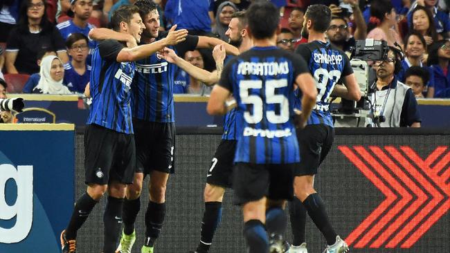 Inter Milan's players celebrate after teammate Stevan Jovetic (L) scored against Chelsea.