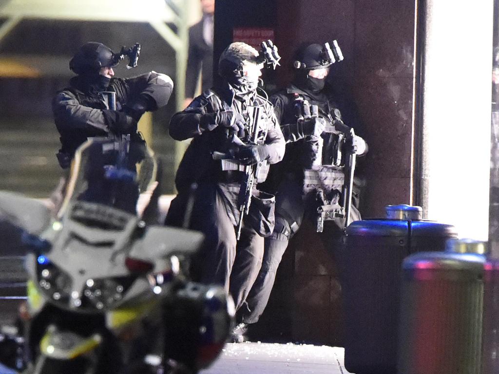 13. Armed officers get the order to move in and end the siege. Picture: Gordon McComiskie