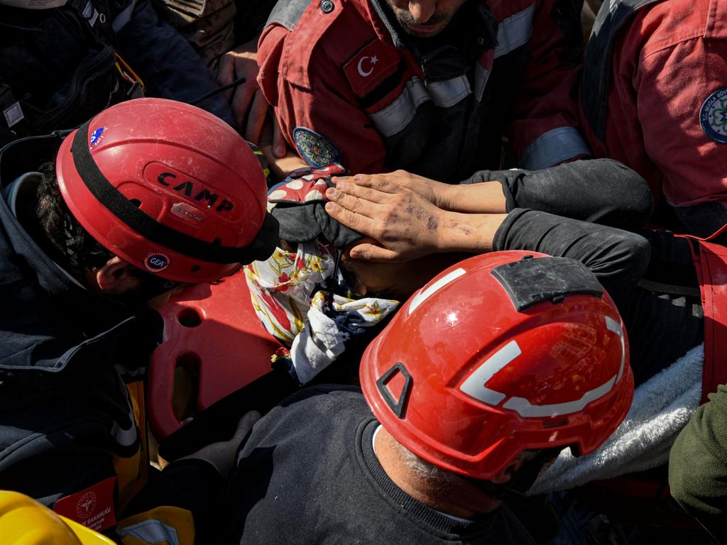 A teacher emerges from the rubble after 152 hours trapped from the earthquake. Picture: Getty Images