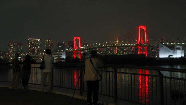 The Rainbow Bridge illuminated in red. Picture: Getty Images