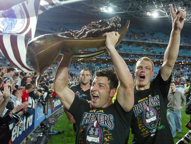 Penrith juniors Craig Gower (with trophy) and Luke Lewis celebrate with fans after the 2003 decider. Pic Gregg Porteous. Rugby League