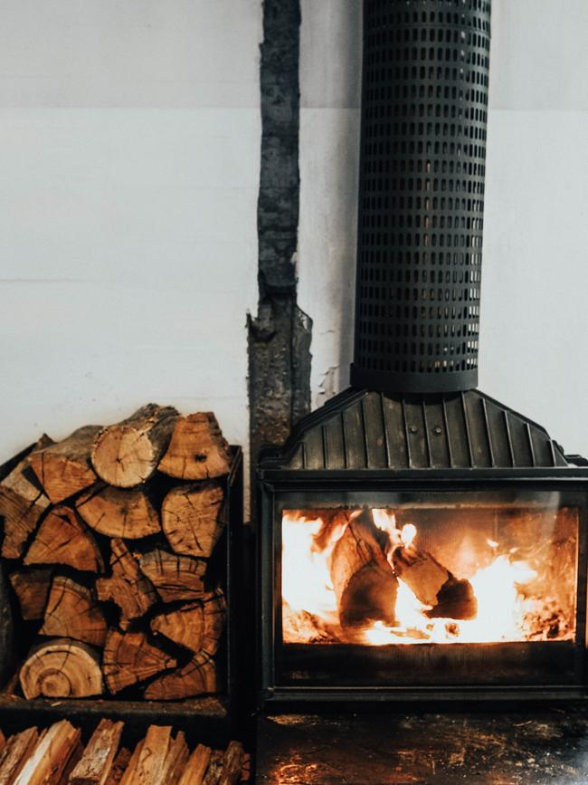 A roaring fire at Tasmania’s Pumphouse Point wilderness retreat at Lake St Clair. Picture: Rachel Vasicek