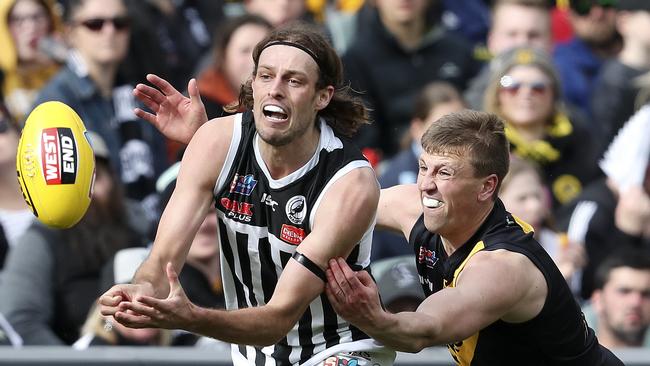 Port Adelaide’s Jarrod Lienert and Glenelg’s Luke Reynolds compete during last year’s SANFL decider. Picture: Sarah Reed