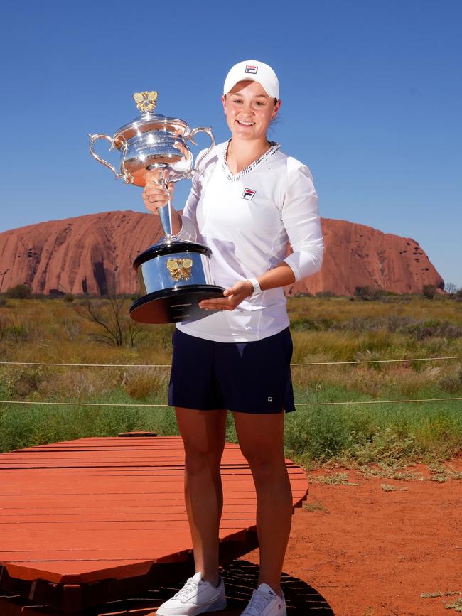 Ash Barty with her Australian Open cup in front of the rock. Picture: TENNIS AUSTRALIA