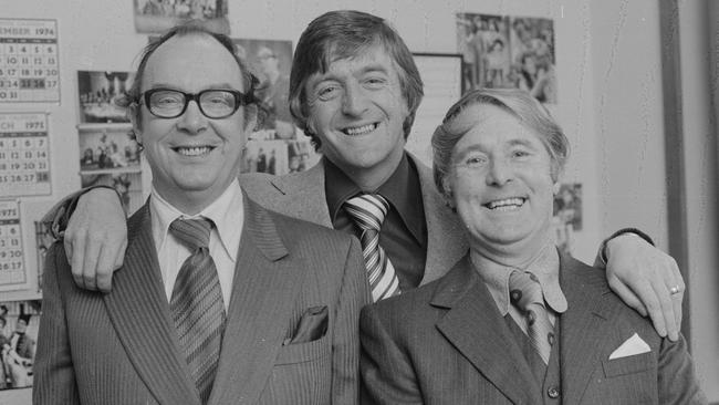 Comedians Eric Morecambe (left) and Ernie Wise with broadcaster Michael Parkinson during filming for the BBC television show 'The Morecambe and Wise Show' in 1976.