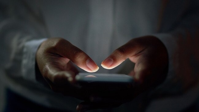 Cropped shot of an unrecognizable woman using a cellphone