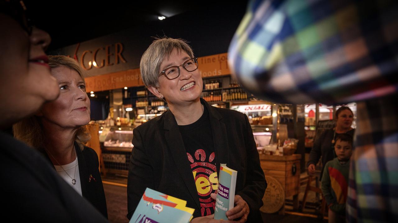 Senator Penny Wong hands out how to vote information at the Central Market. Picture: Emma Brasier