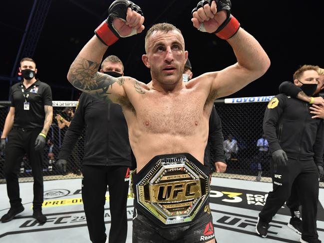 ABU DHABI, UNITED ARAB EMIRATES - JULY 12: In this handout image provided by UFC, Alexander Volkanovski of Australia celebrates after his split-decision victory over Max Holloway in their UFC featherweight championship fight during the UFC 251 event at Flash Forum on UFC Fight Island on July 12, 2020 on Yas Island, Abu Dhabi, United Arab Emirates. (Photo by Jeff Bottari/Zuffa LLC via Getty Images)