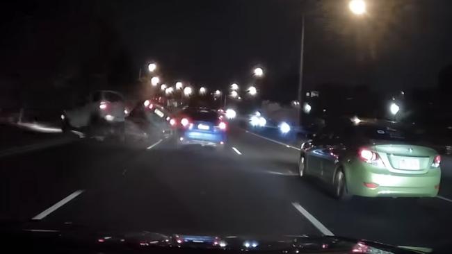 The moment of the collision, with the white hatchback (left) flipping multiple times. The black sedan is also seen briefly leaving the road. Picture: Supplied / Dash Cam Owners Australia