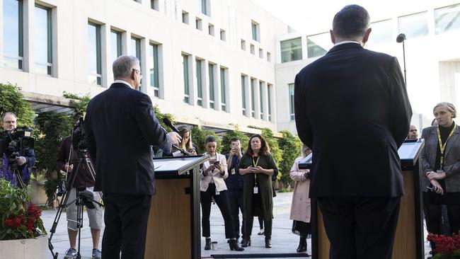 Scott Morrison and Chief Medical Officer Brendon Murphy practise social distancing as they face the media on Wednesday. Picture: Gary Ramage