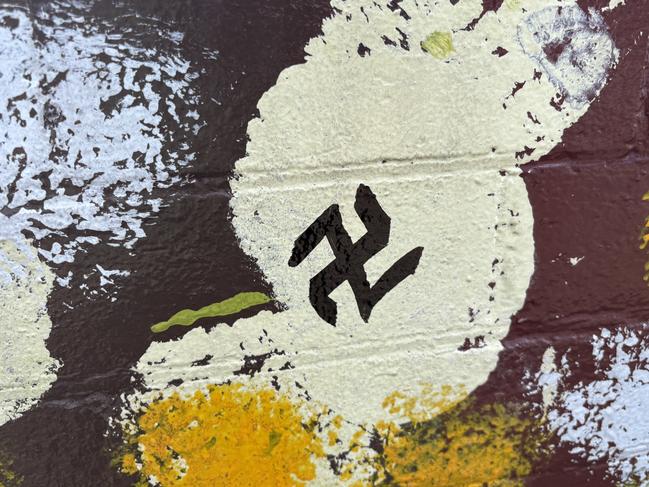 Swastika daubed on a wall near Sydenham train station. Picture: Supplied.