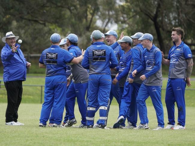 Langwarrin players celebrate a wicket. Picture: Valeriu Campan