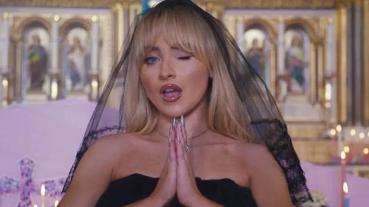 Priest stripped of duties over pop video