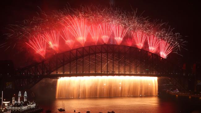 Fireworks pour like a waterfall off the Harbour Bridge. Picture: Getty Images.